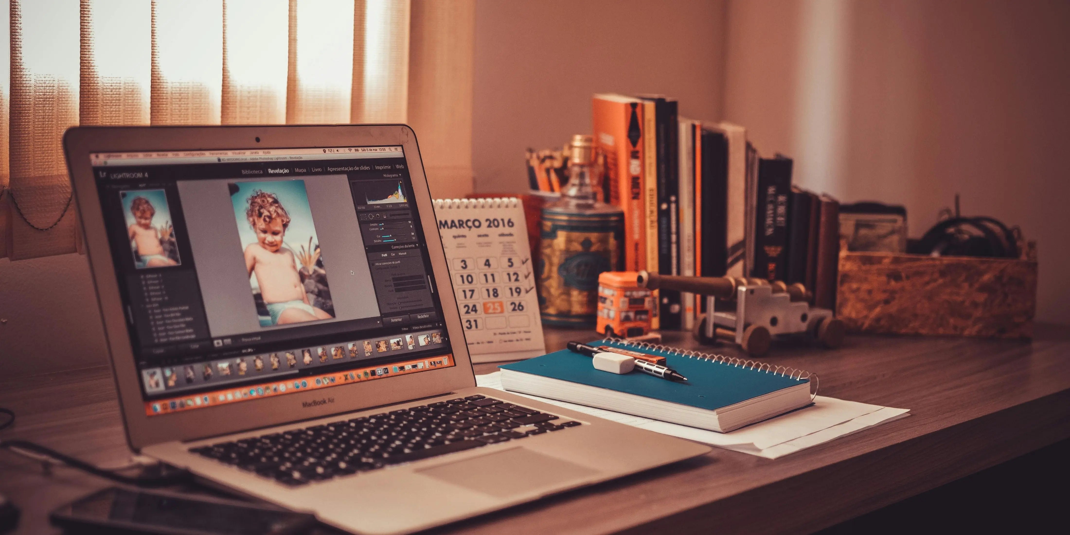 Someone is editing a music video on a MacBook Air.